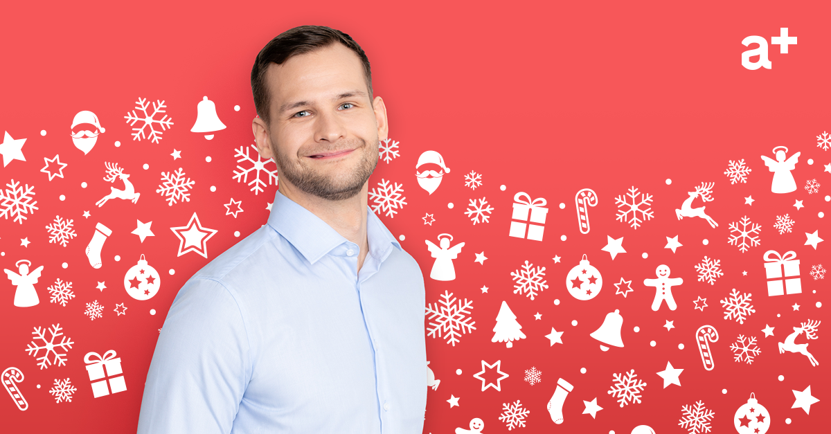 man smiling with red winter background