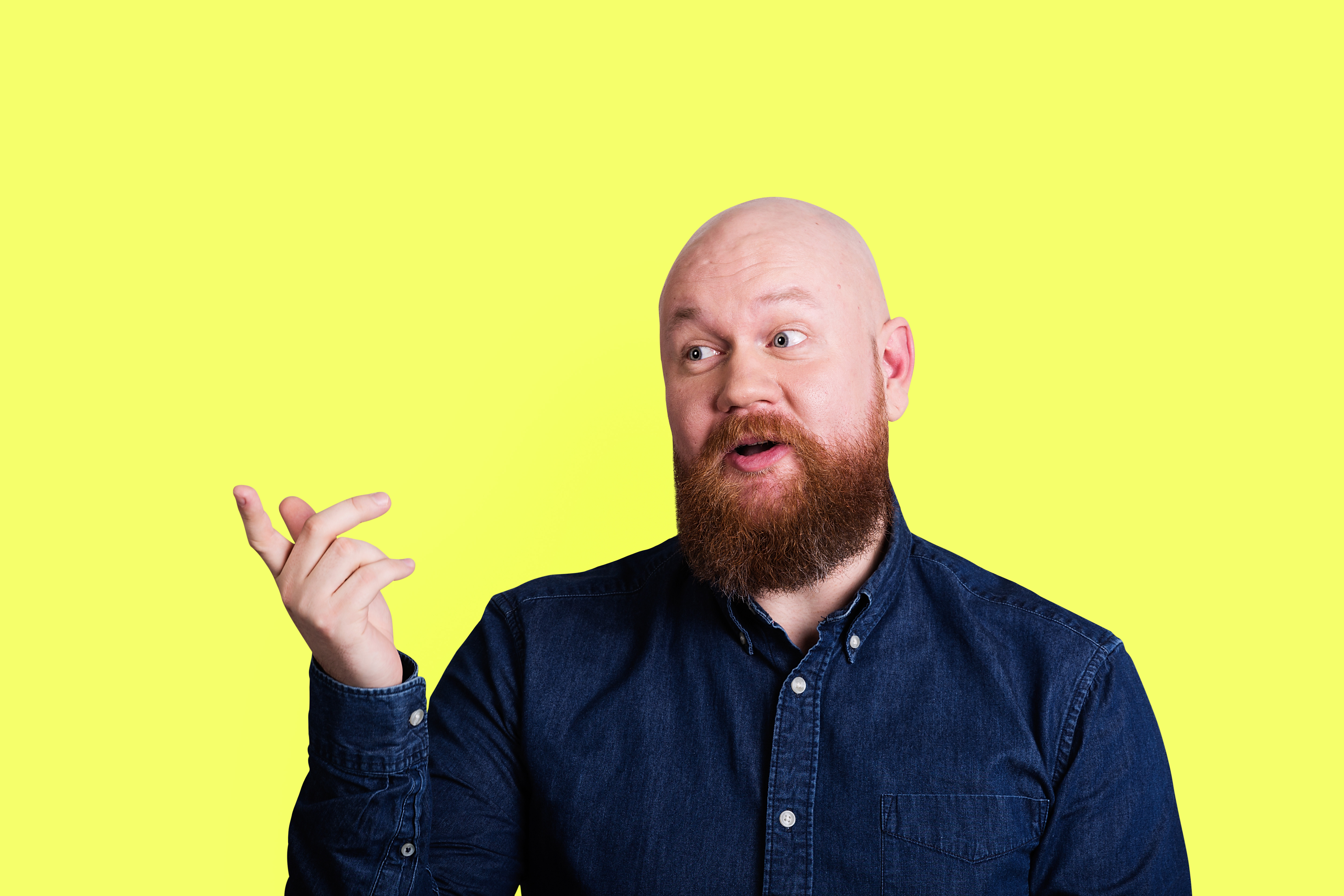 man with read beard on yellow