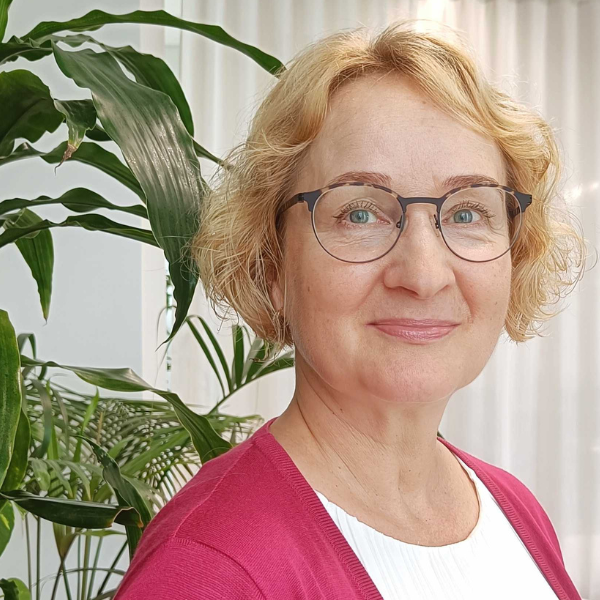 Woman with glasses smiling