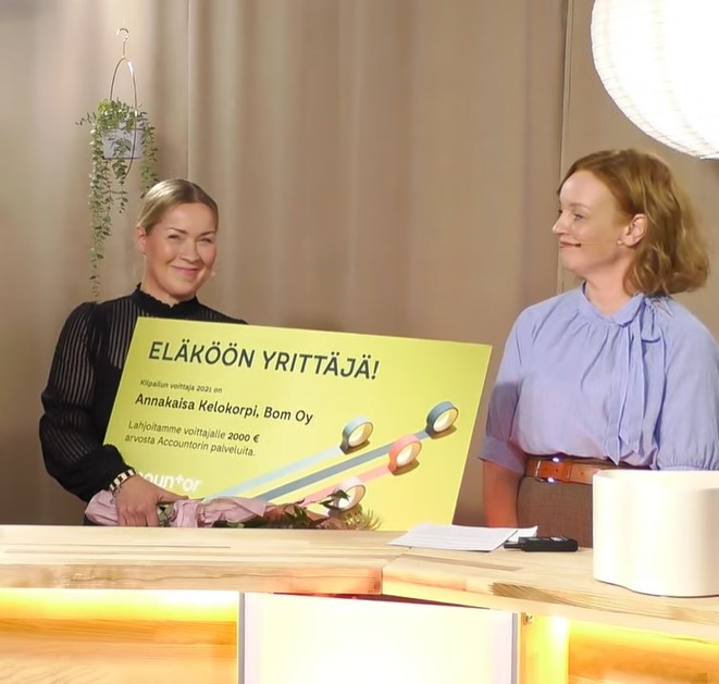 two women with award
