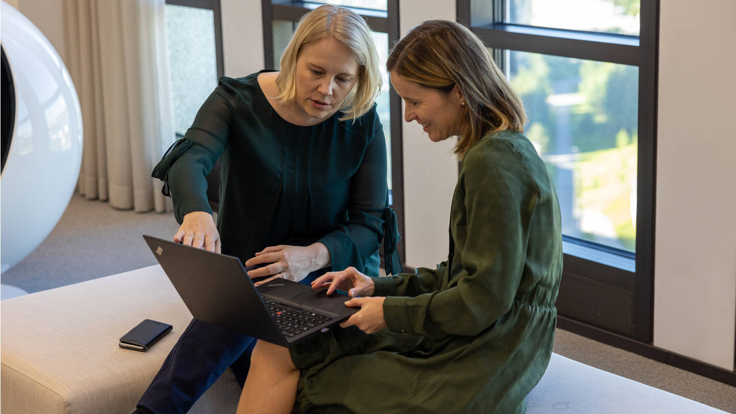 Two women sitting casual meeting