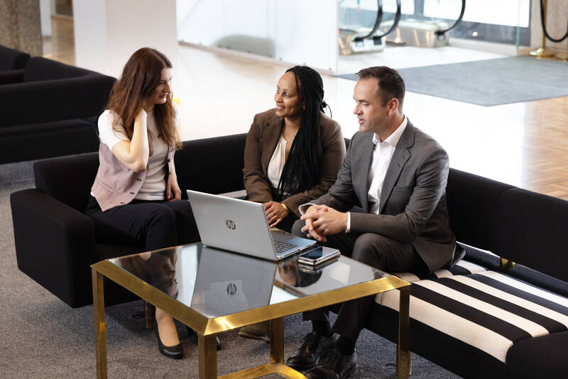 Meeting_three colleagues, laptop, table