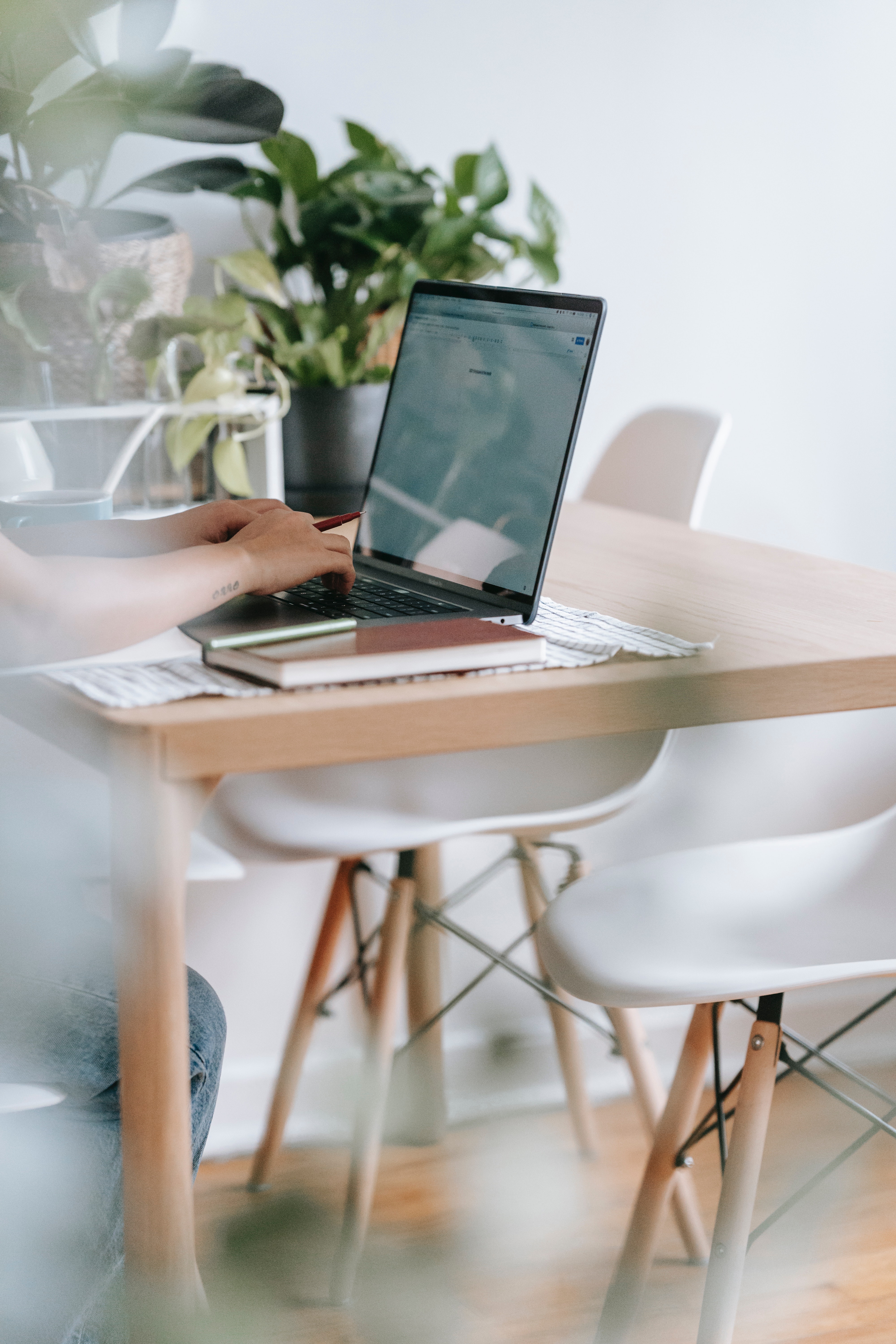 Photo by Teona Swift: https://www.pexels.com/photo/unrecognizable-worker-typing-on-laptop-at-table-with-flowers-6913825/