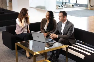 Meeting_three colleagues, laptop, table