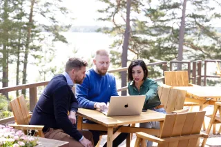 three people working outside