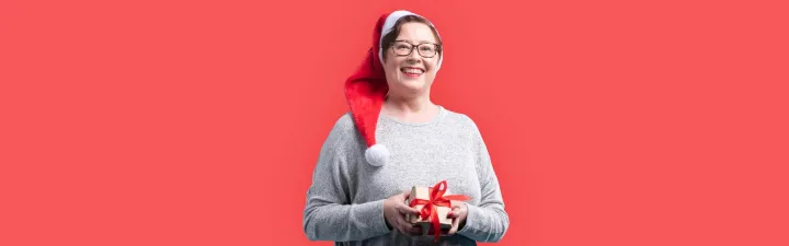 Woman with Christmas hat and present