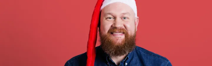 man smiling with red hat