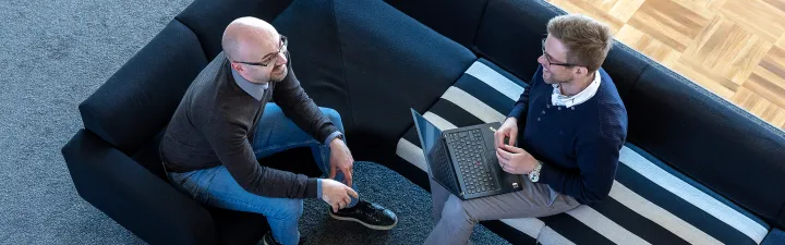 Meeting consulting two men laptop