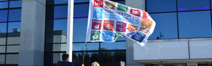 People raising a flag