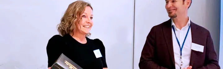 woman and man in award ceremony