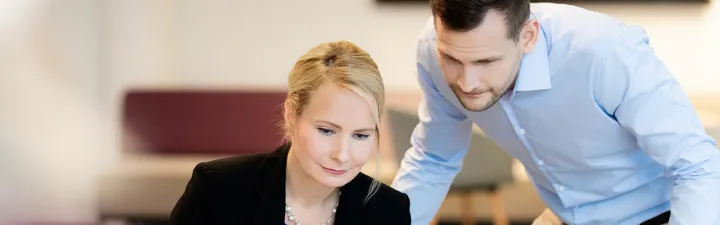 woman-man-checking-numbers_1200x628 some