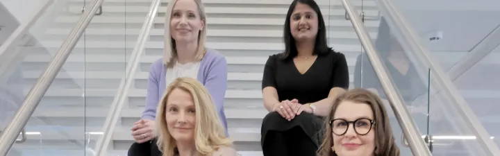 women sitting on stairs