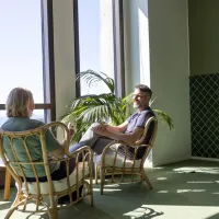 woman and man in green office