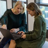 Two women sitting casual meeting