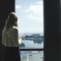 woman looking out of the window